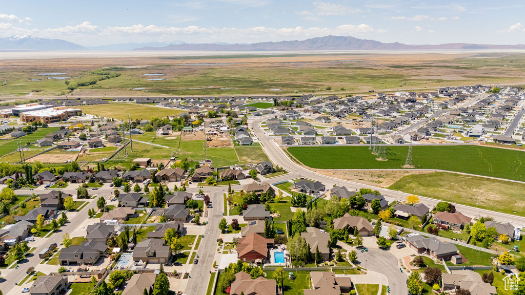 Aerial perspective of suburban area with a mountain backdrop