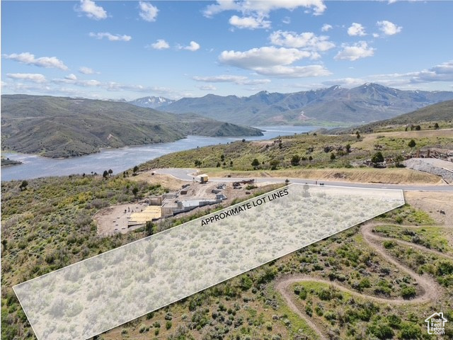 View of mountain backdrop featuring a large body of water