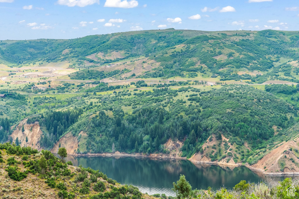View of mountain backdrop with a nearby body of water