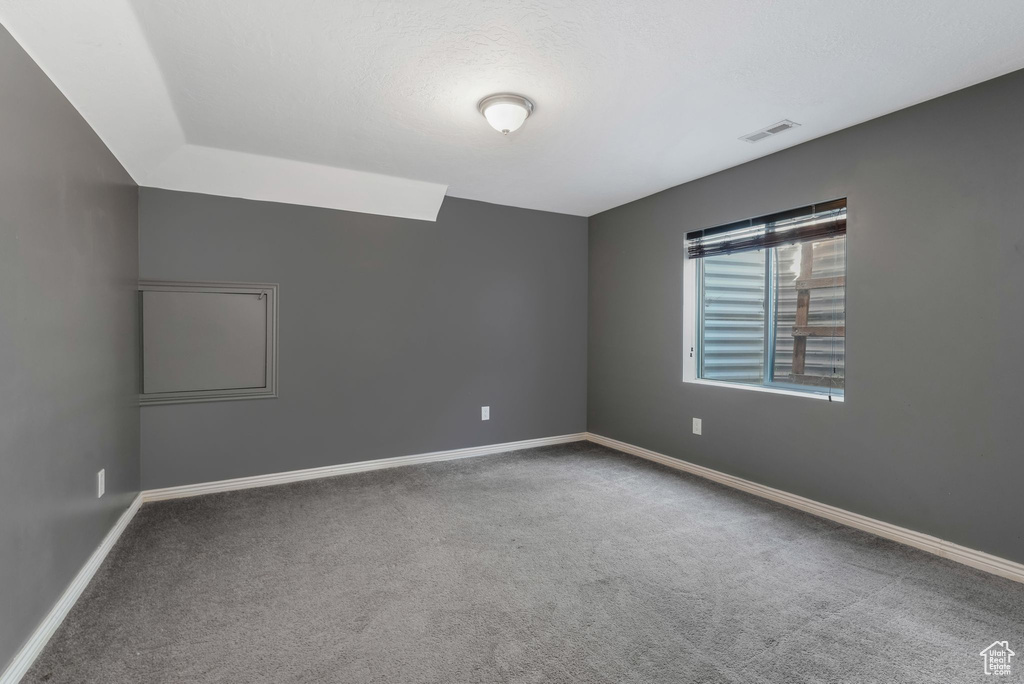 Unfurnished room with carpet flooring and baseboards