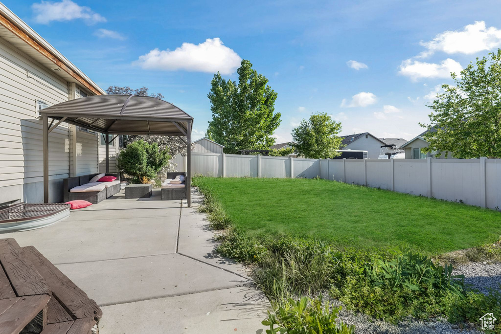 View of yard with an outdoor living space, a gazebo, and a patio