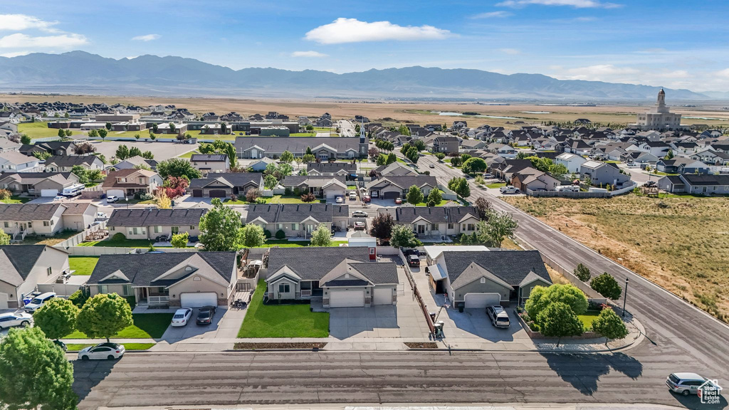 Aerial view of residential area featuring a mountain backdrop