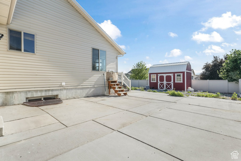 View of side of property featuring a patio area