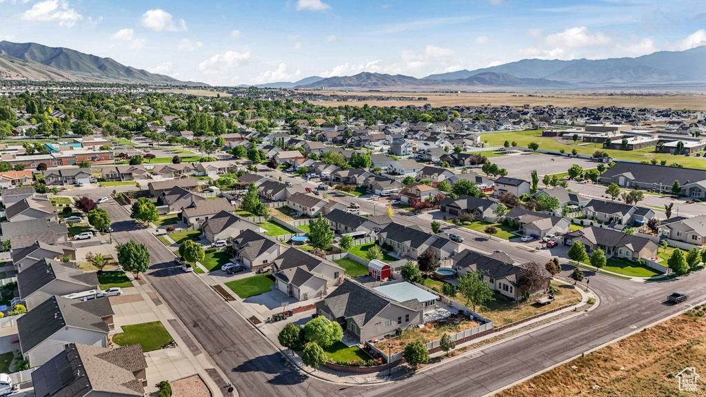 Aerial view of residential area with a mountainous background