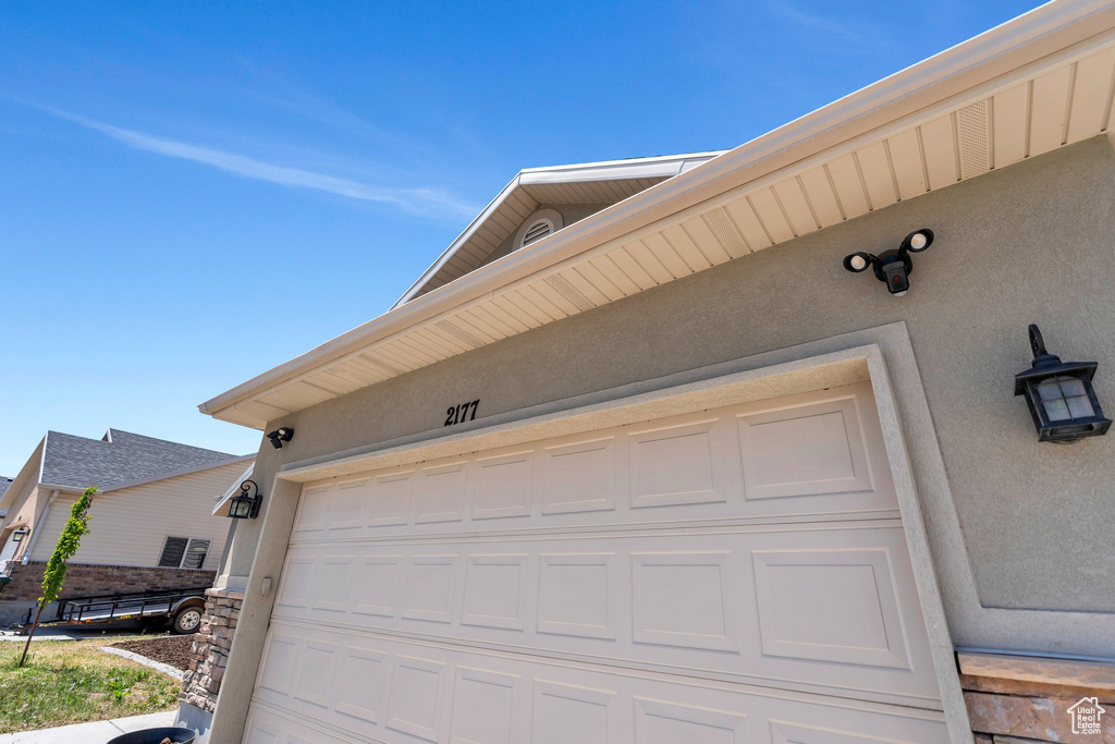 Garage featuring driveway