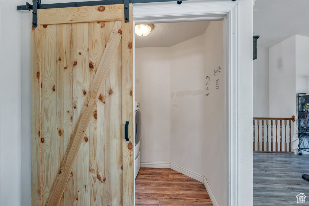 Bathroom featuring wood finished floors and baseboards