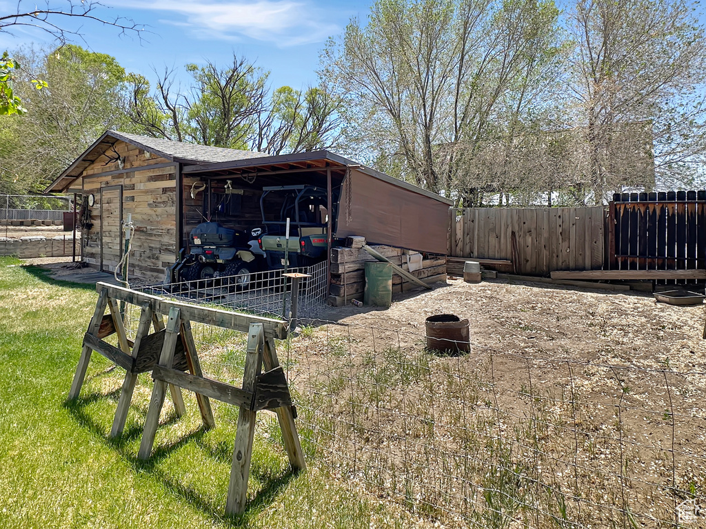 View of side of home with an outbuilding