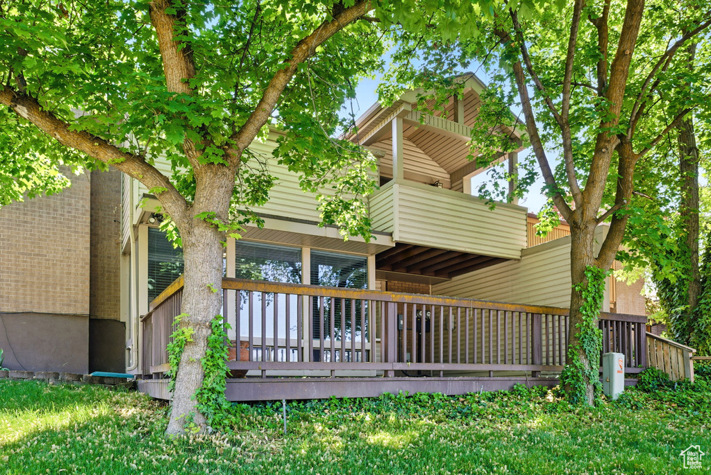 Rear view of property featuring a balcony