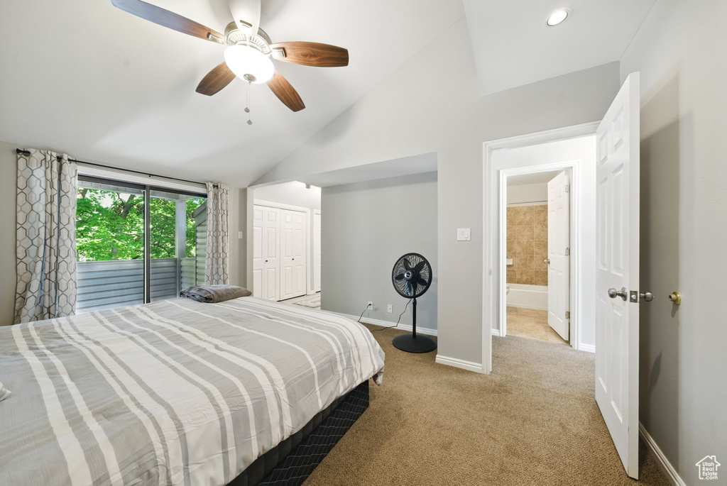 Bedroom featuring lofted ceiling, carpet flooring, baseboards, ceiling fan, and a closet