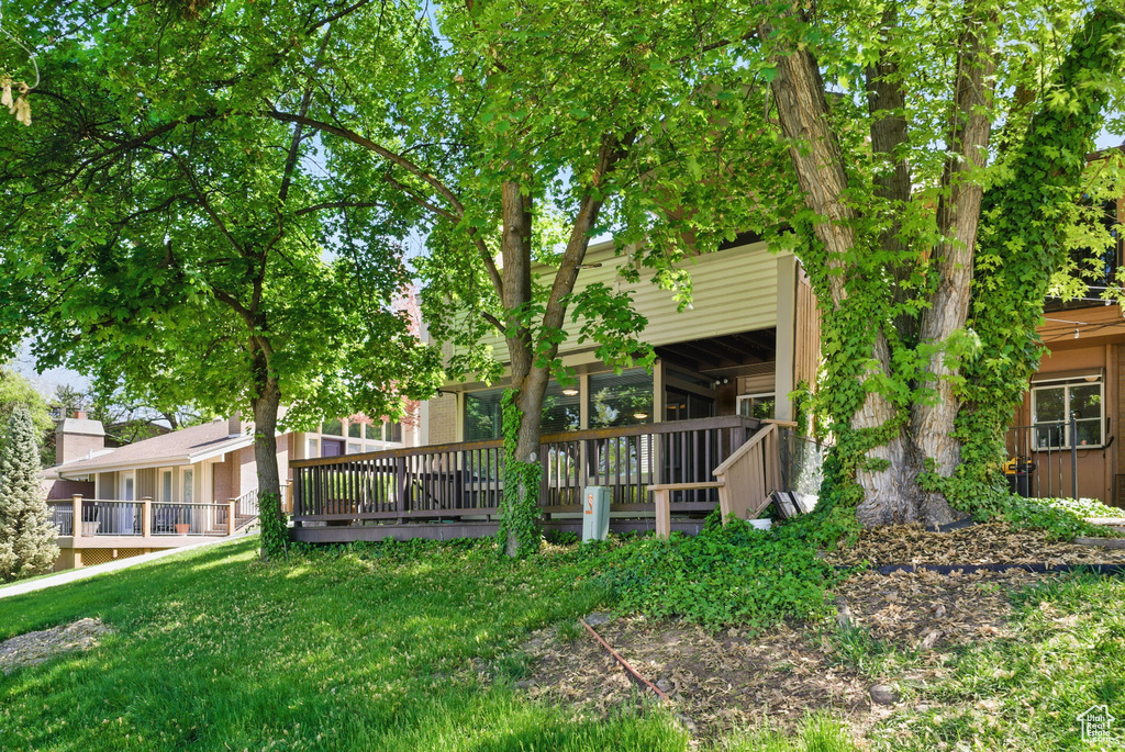 Rear view of house with a wooden deck