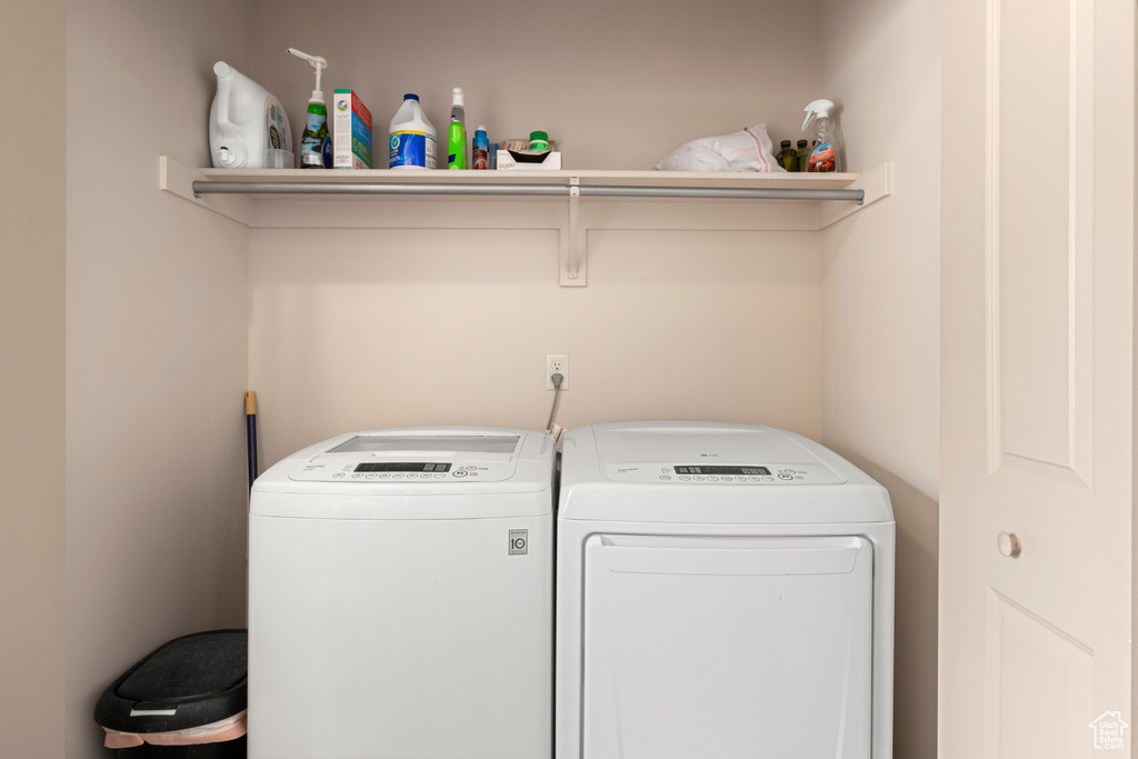 Washroom featuring washing machine and clothes dryer