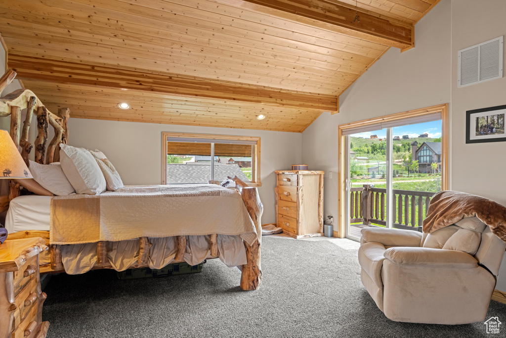 Bedroom with access to exterior, wooden ceiling, carpet, and recessed lighting