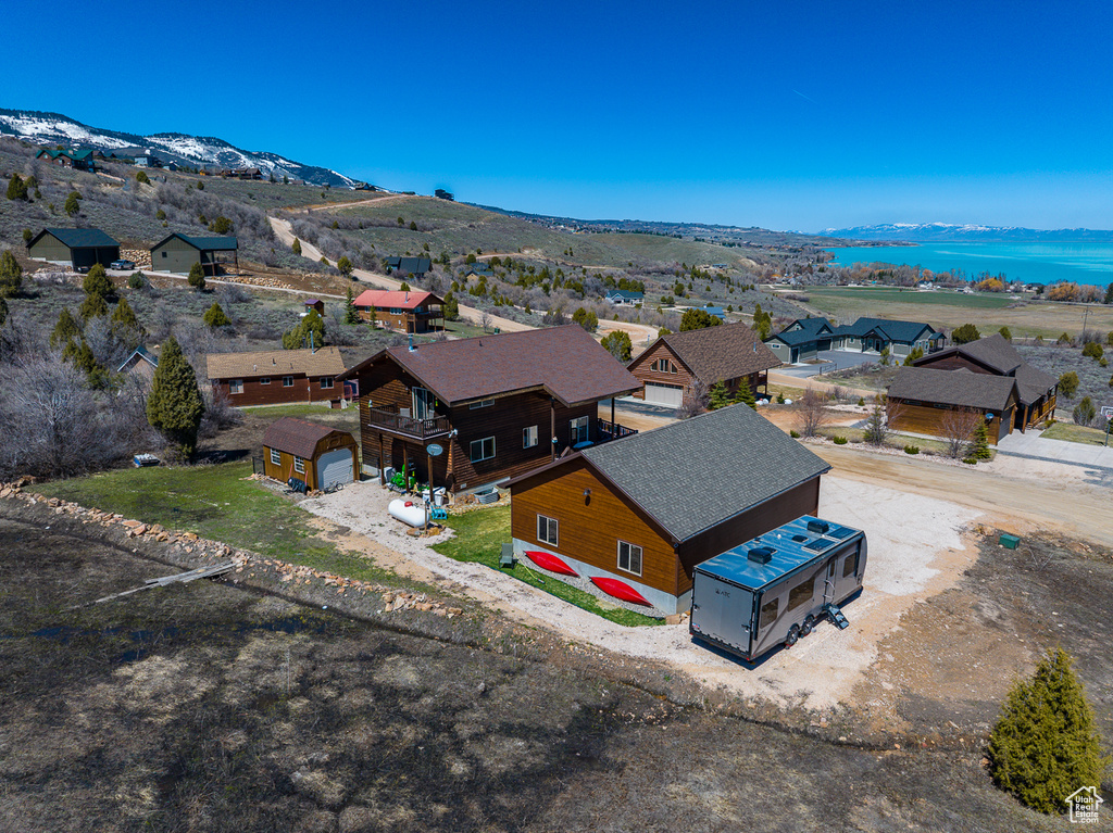 Aerial perspective of suburban area featuring a water and mountain view