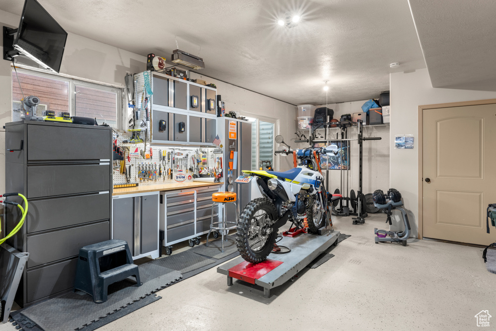 Garage featuring a workshop area