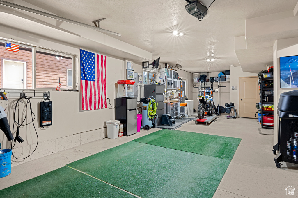 Garage featuring a garage door opener