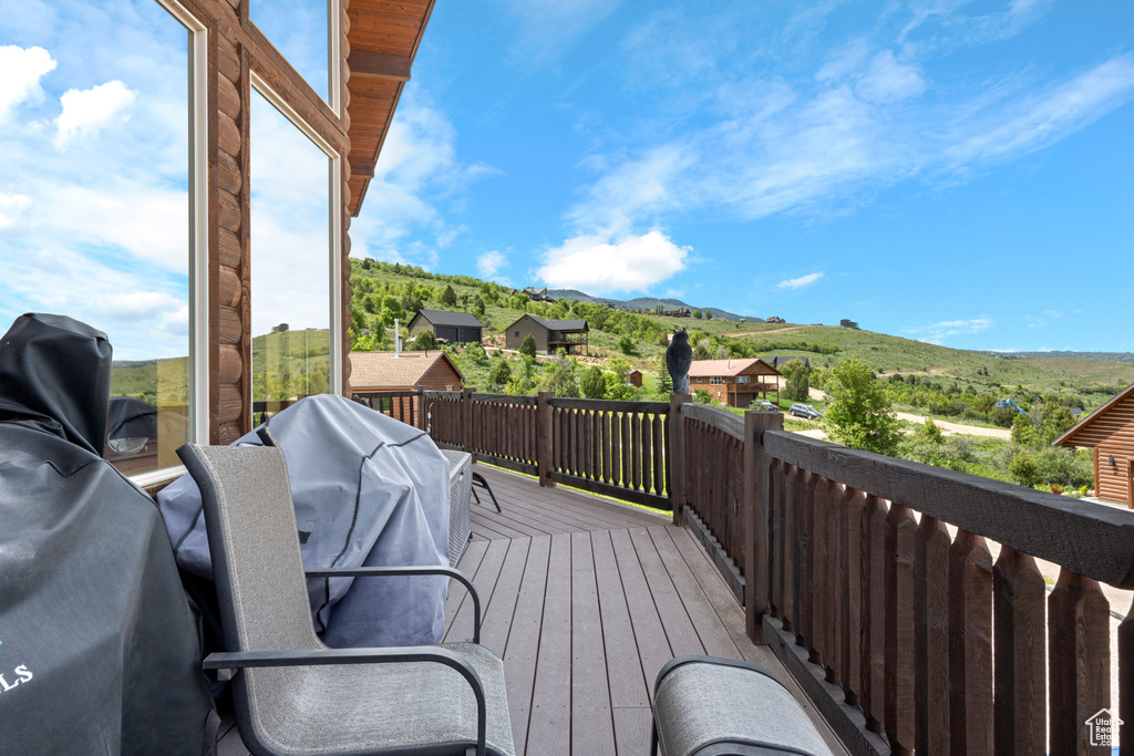Wooden deck featuring a mountain view