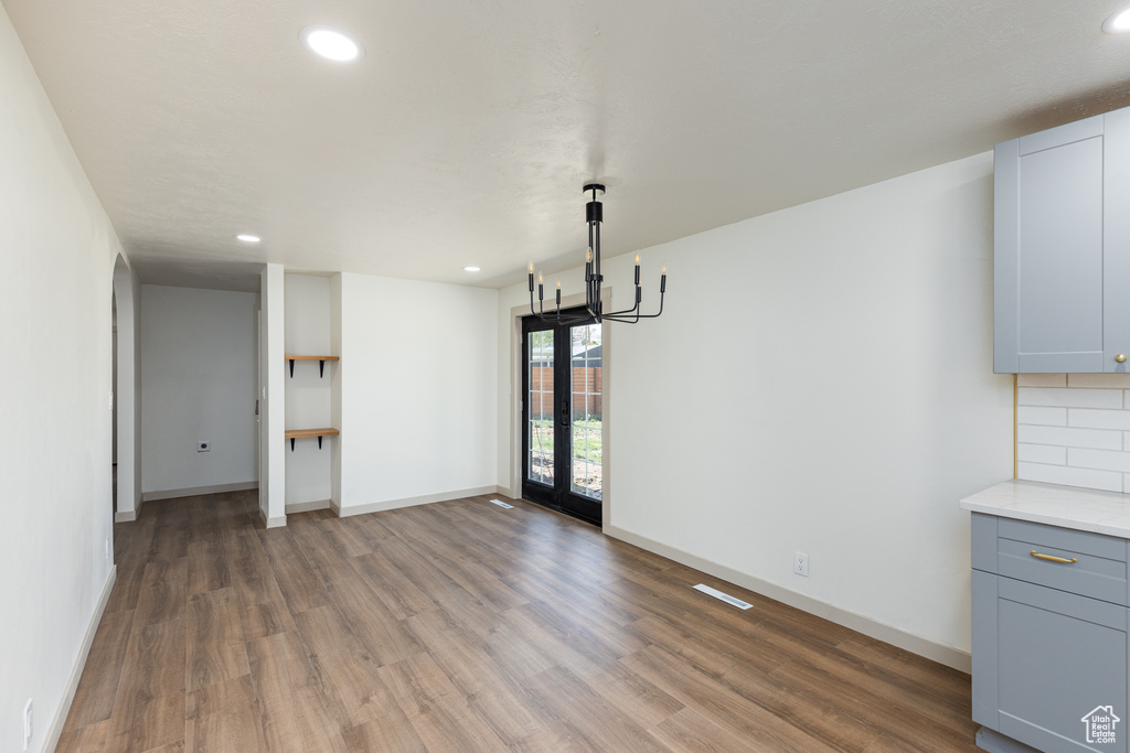 Unfurnished dining area with light wood-type flooring, recessed lighting, and baseboards