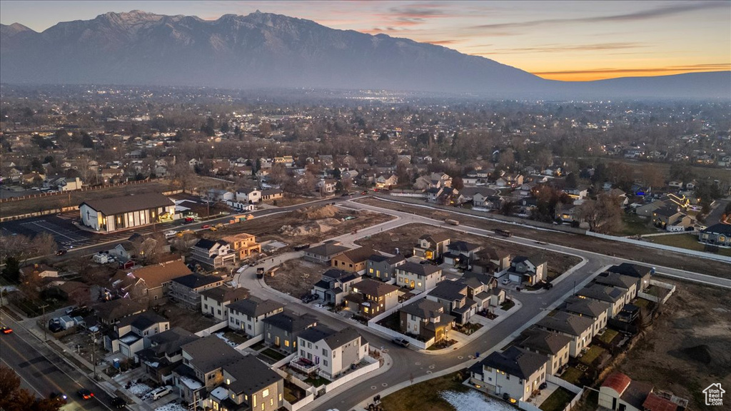 View of property location featuring a mountain backdrop and nearby suburban area