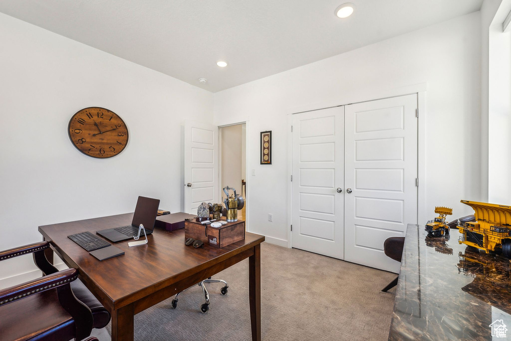 Office area featuring light carpet and recessed lighting