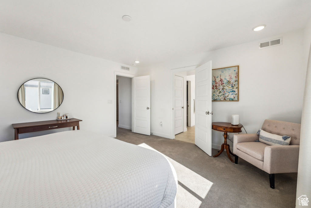 Bedroom with carpet floors, baseboards, and recessed lighting