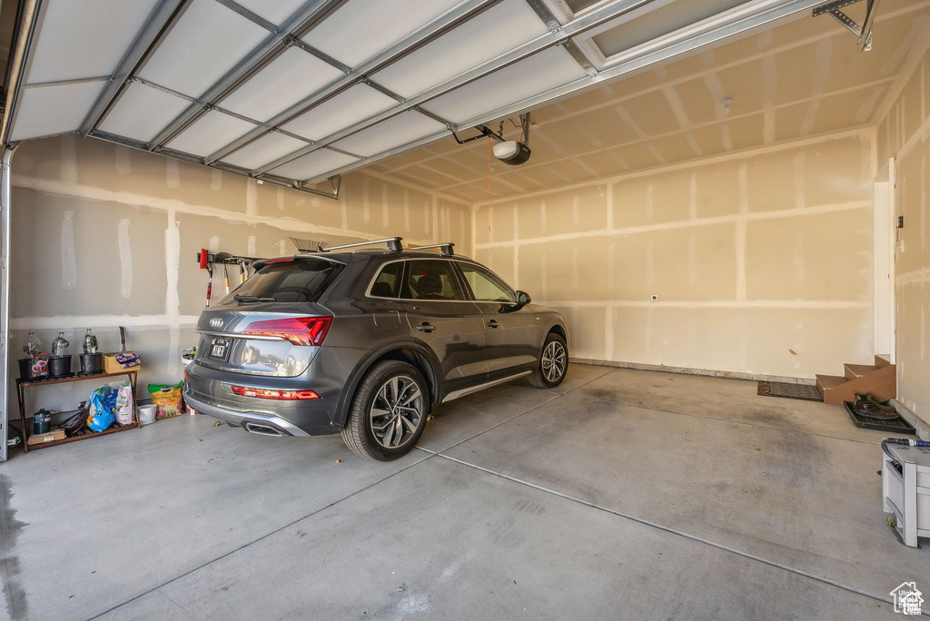 Garage featuring a garage door opener
