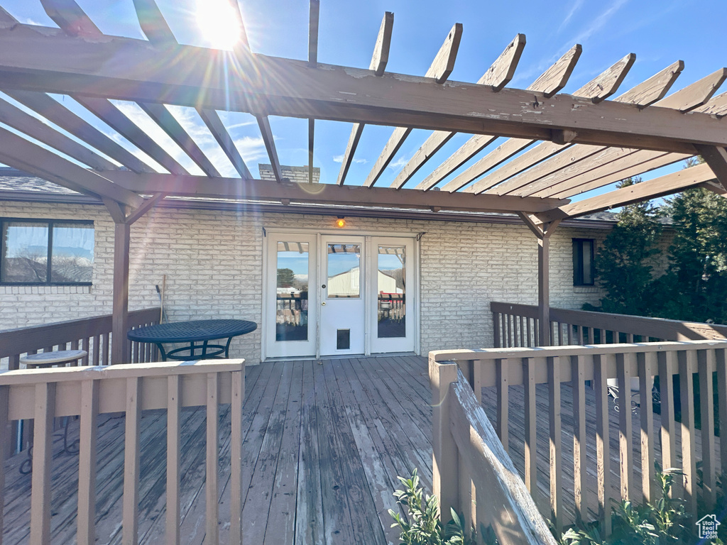 Wooden deck featuring a pergola