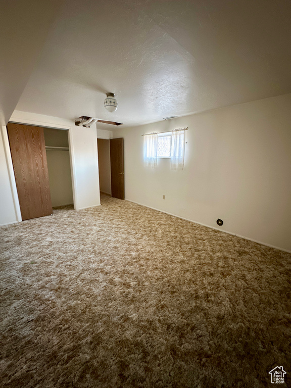 Unfurnished bedroom with carpet and multiple closets