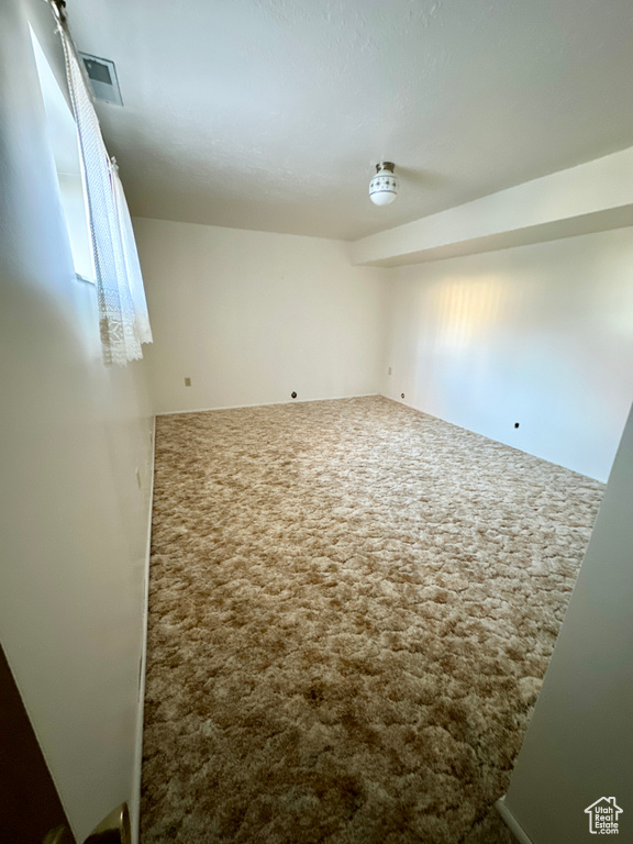View of carpeted spare room
