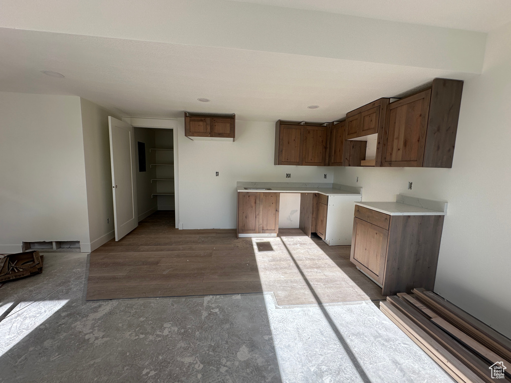 Kitchen featuring baseboards and wood finished floors