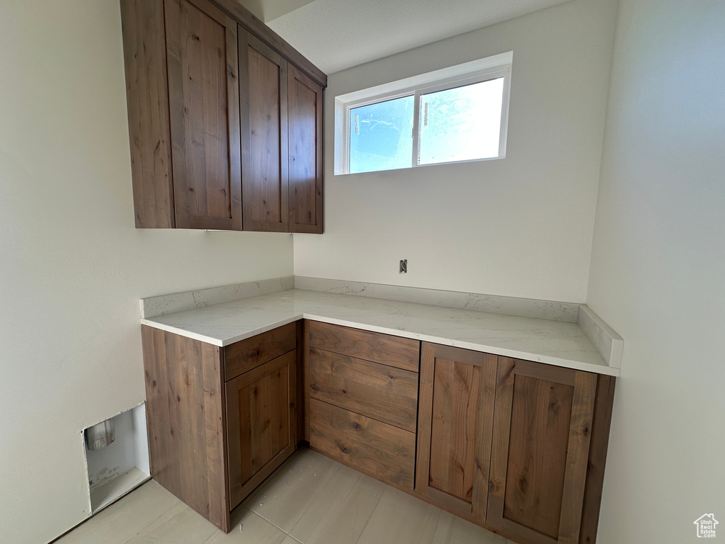 Kitchen featuring light countertops