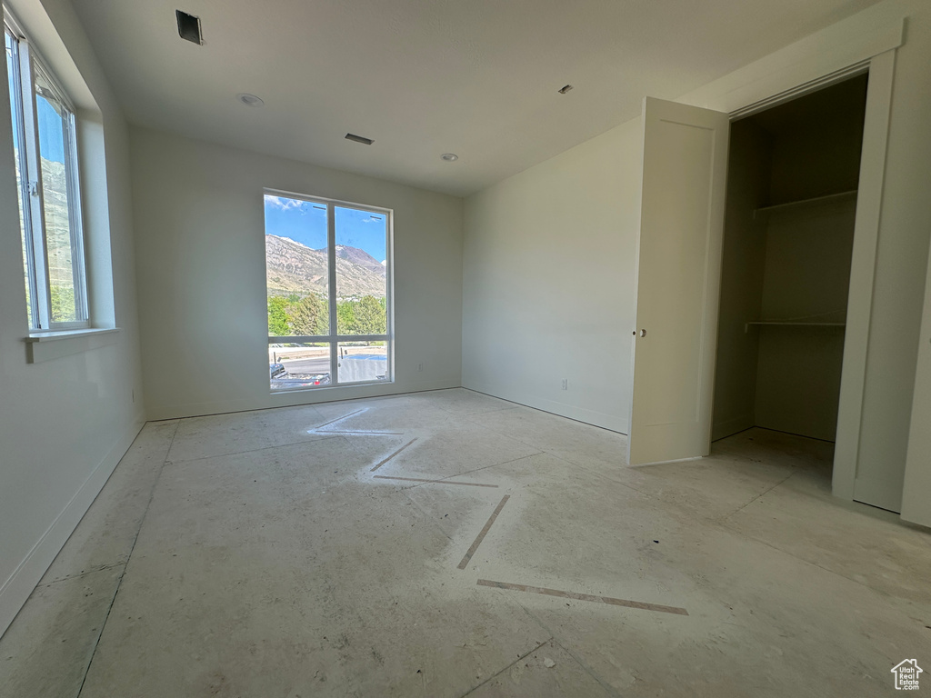 Unfurnished bedroom with baseboards