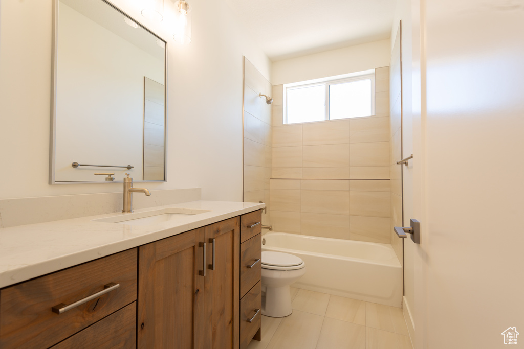 Full bathroom with vanity, bathtub / shower combination, and tile patterned floors