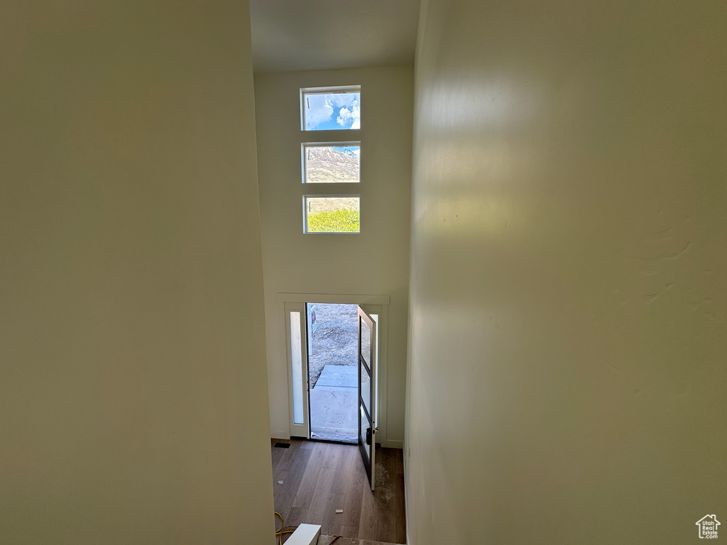Stairway featuring wood finished floors and baseboards