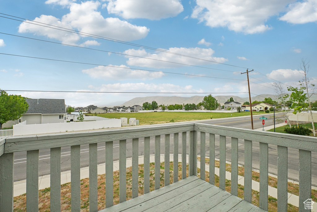 Deck featuring a residential view and a mountain view