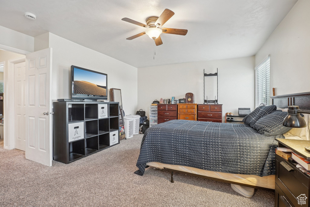Bedroom with carpet and a ceiling fan