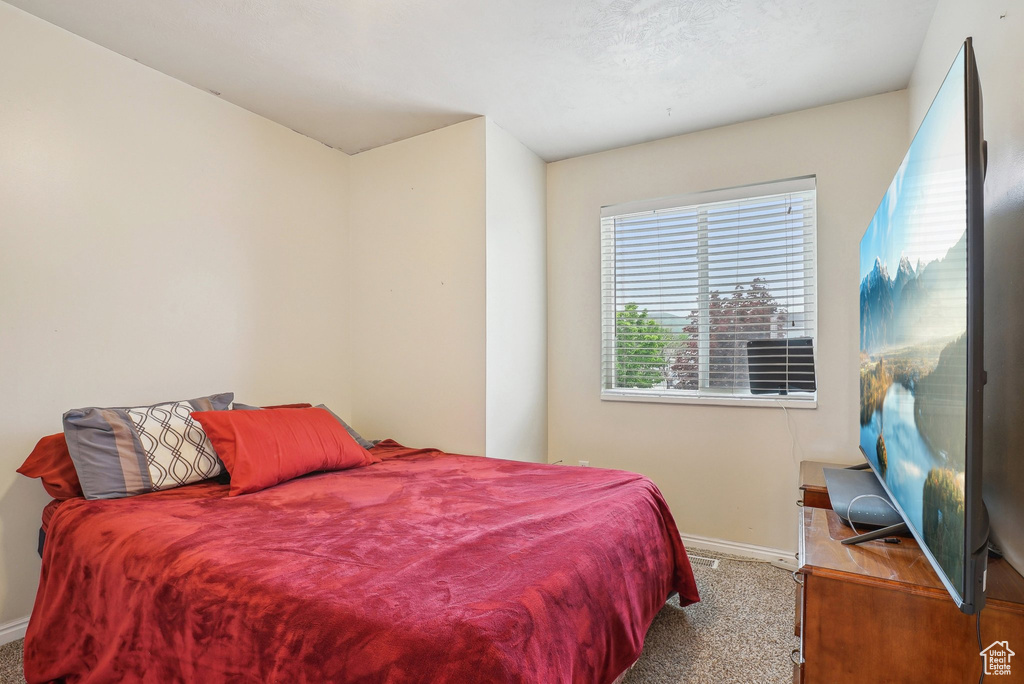 Carpeted bedroom with baseboards