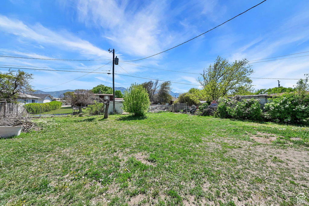 View of yard featuring fence