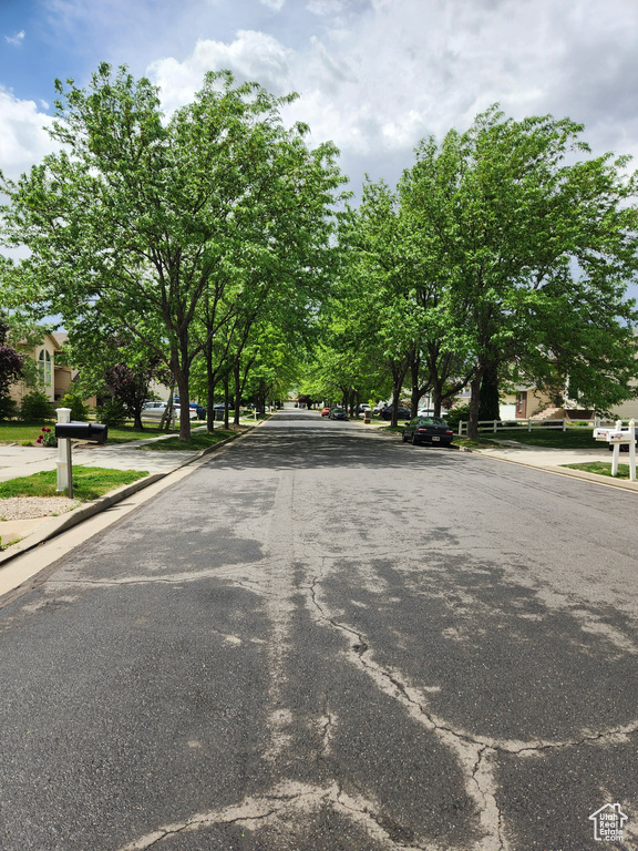 View of asphalt road with curbs