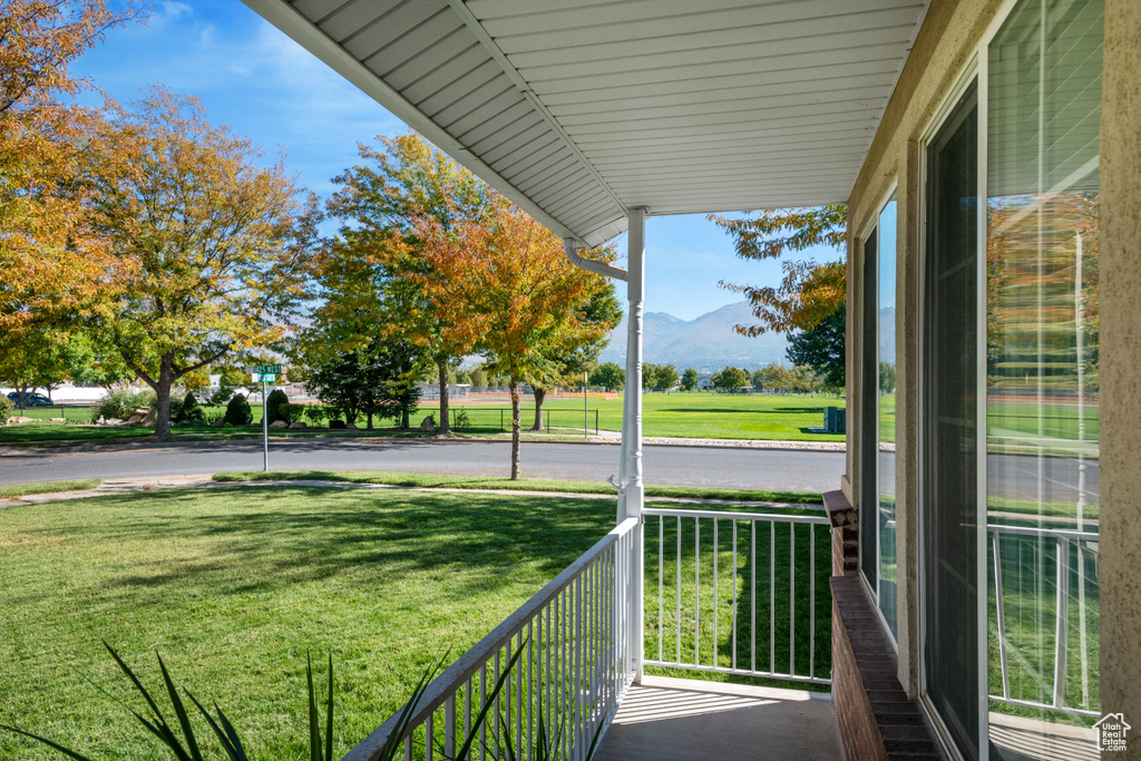 Balcony featuring a porch and a mountain view