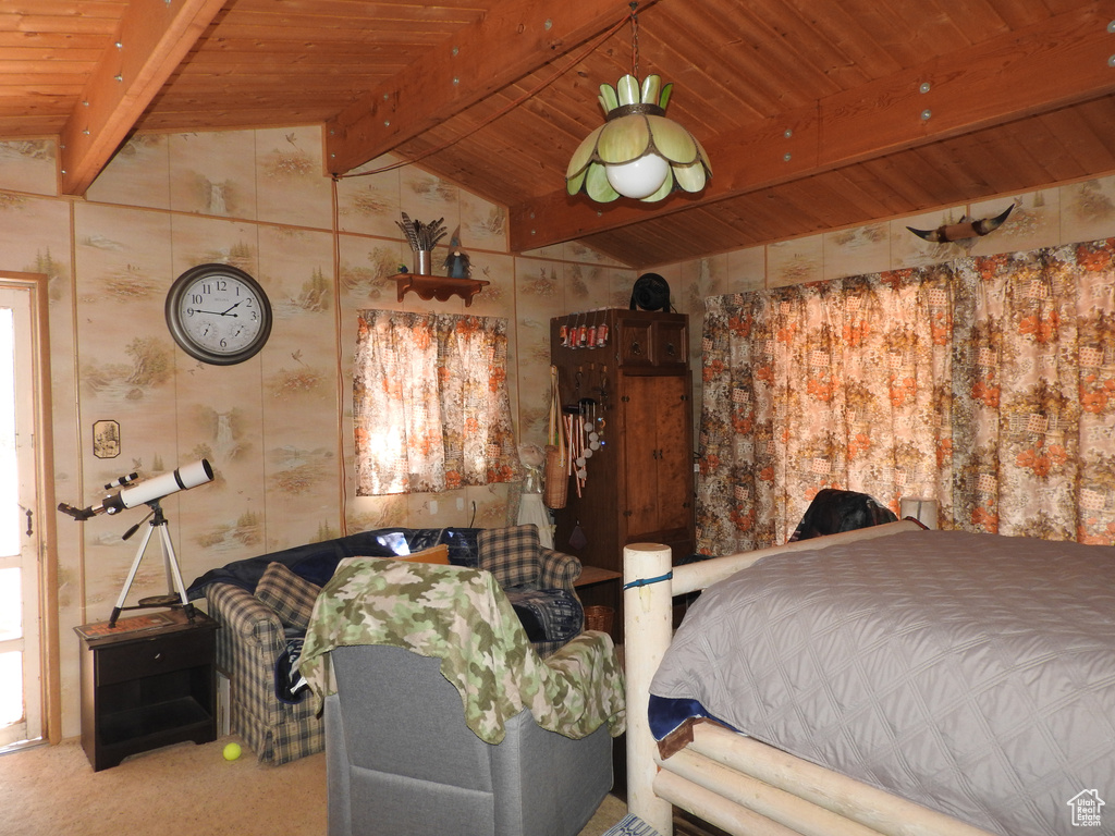 Bedroom featuring wood ceiling, carpet flooring, and wallpapered walls