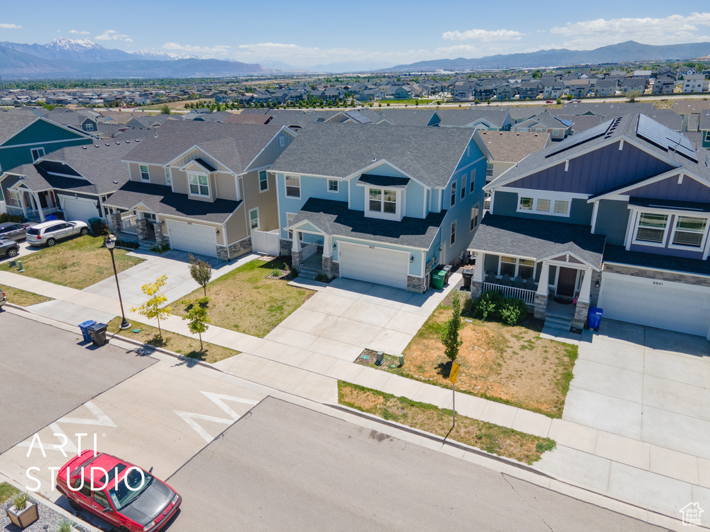 Aerial view of residential area featuring mountains