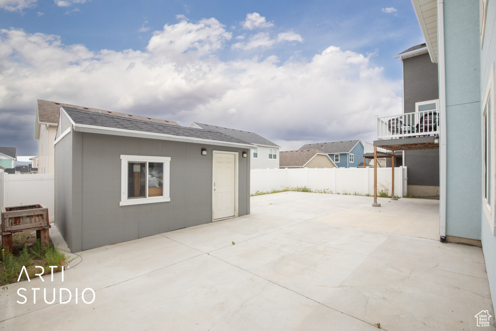 View of patio with a fenced backyard