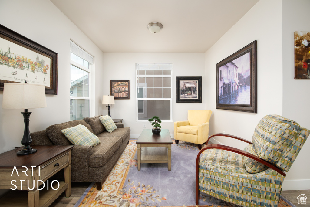 Sitting room featuring baseboards and wood finished floors