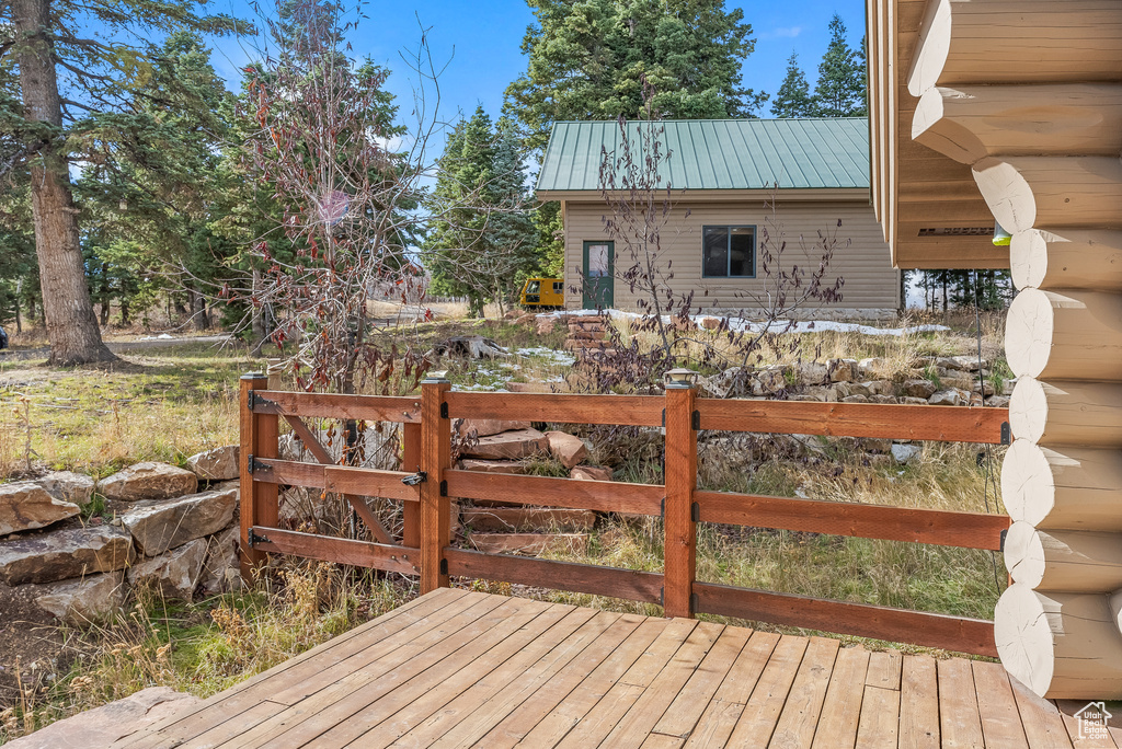 Wooden deck featuring a gate