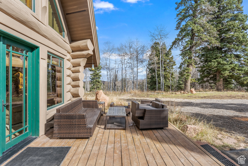 Wooden terrace with an outdoor living space