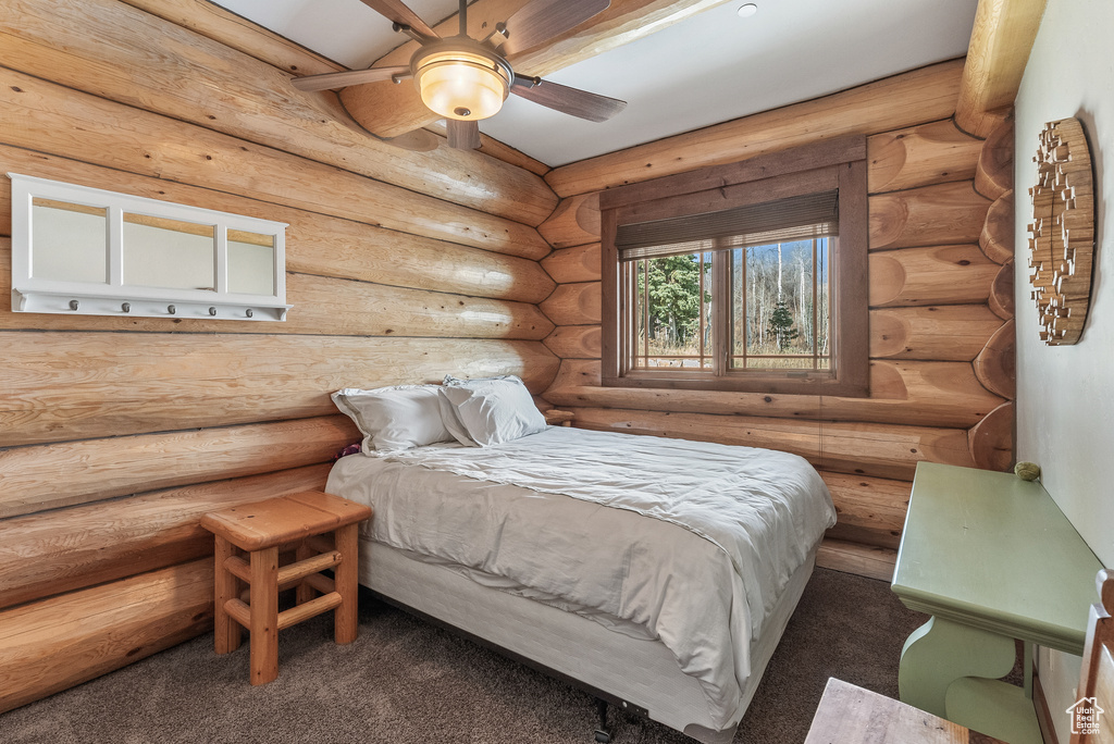 Bedroom with dark colored carpet