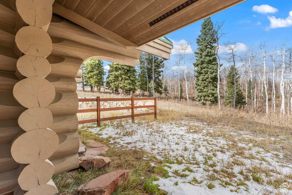 Snowy yard with fence