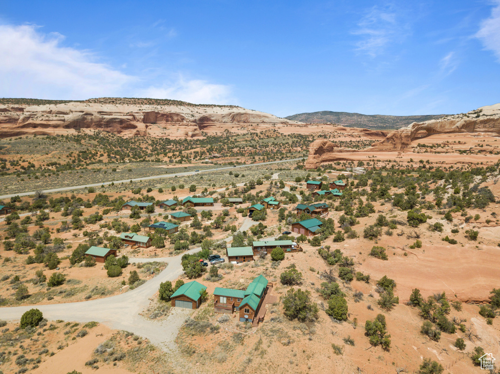 Aerial view of sparsely populated area with a desert landscape and mountains