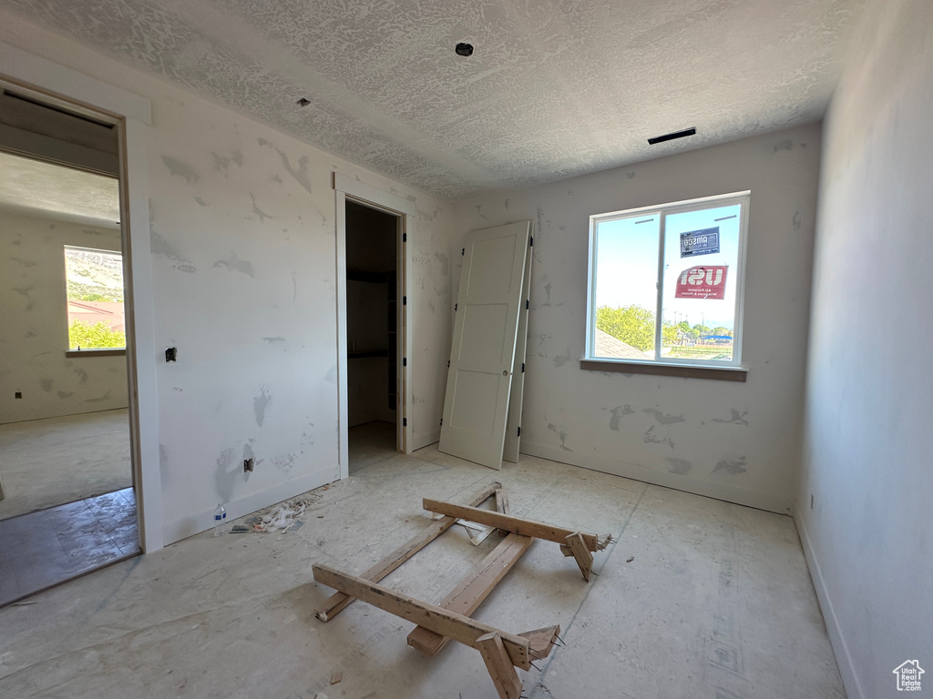 Unfurnished bedroom with a textured ceiling