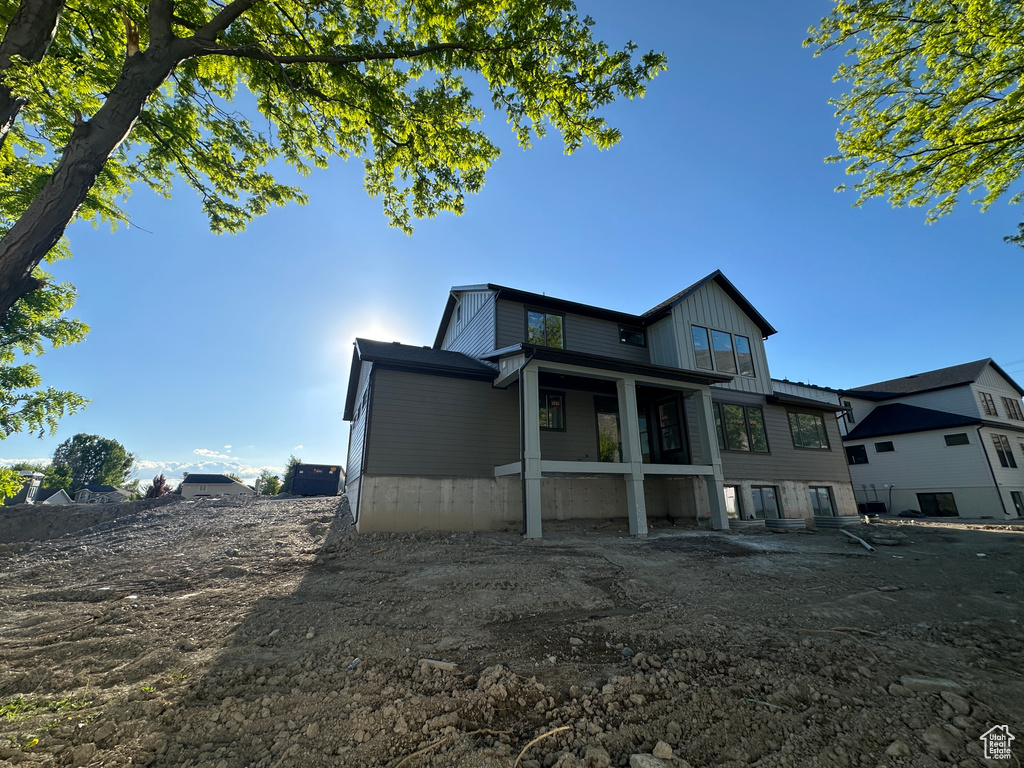 Back of property featuring board and batten siding